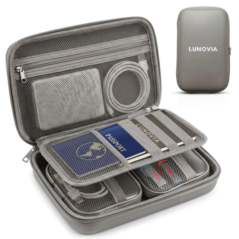 Knock Off Cable Tangles Grab And Go Hard Shell Tech Organizer With Removable Pouches For Phones Chargers Earbuds Mouse And Cords in gray with cables and passport inside.