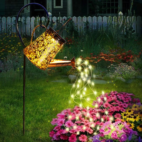 Watering Can Solar Lights With Cascading Glow For Outdoor Vibe Hanging Lantern displayed in garden with glowing lights