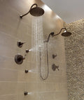 Cassidy Single Lever Bath Diverter and Transfer Valve Handle Kit in Venetian Bronze installed in modern shower