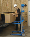 Worker using Beefy Aluminum Manual Lift With Telescoping Frame 400 Lb Capacity 10 Ft Lift Height Multi Use Hand Truck Forklift Dolly