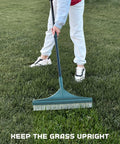 Person using Artificial Turf Rake For Pet Hair, Leaves And Debris, Adjustable 63 Inch Telescoping Handle on artificial grass.