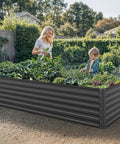 Galvanized Raised Garden Bed Kit 8x4x2 Ft Large Metal Planter Box With Gloves Safety Rubber and Support Rods for No Sweat Setup Outdoor Garden Bed for Vegetables and Flowers Black in garden with plants and people.