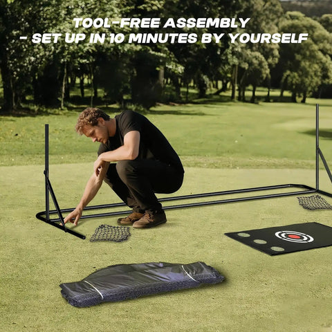 Person setting up 10x10 golf hitting net with side barriers and ball return system for indoor practice, components on grass