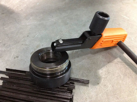 External And Internal Thread Restorer Kit for Inches And Metric Threads showing tool repairing internal threads on metal piece