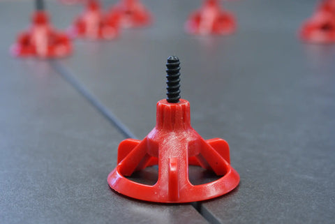 Tile Leveling System with One Eighth Inch Spacer Posts, 250 Pieces, Black Baseplates and Caps Sold Separately in use on gray tile