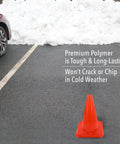 Bright Orange 18 Inch Traffic Cone Built Tough For Weather Resistance on asphalt near parked car with snow in background
