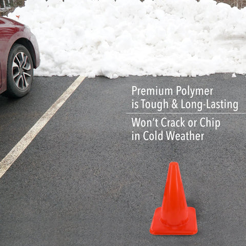 Bright Orange 18 Inch Traffic Cone Built Tough For Weather Resistance on asphalt near parked car with snow in background