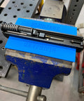 Heavy Duty Heat Resistant Magnetic Soft Jaws For Bench Vise Drill Press Clamps with blue jaws on a work vise setup.