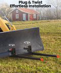 Close-up of 60-Inch Clamp-On Pallet Forks for Tractor Bucket, 2000 lbs capacity, attached to a tractor in a field, plug and twist system visible.