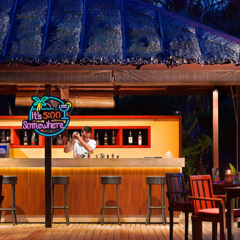 Five O Clock Somewhere Palm LED Neon Sign Wall Light at outdoor bar with bartender, bright colors, wooden patio setting.