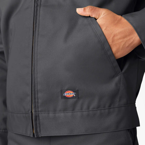 Close-up of Classic Mens Lined Eisenhower Jacket Heavy Duty Workwear Rugged Poly Cotton Twill Wrinkle Resistant Charcoal Plus Size 3X pocket and logo.