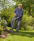 Man using the Nature Line Spading Fork for Quick, No-Fuss Root-Safe Digging and Loosening Soil in Garden Beds, Heavy-Duty Hardened Steel Tines.
