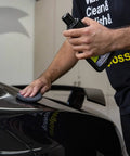Person using All In One Car Wax Cleaner That Cleans Dirt Grime And Water Spots, Removes Light Scratches On car surface.