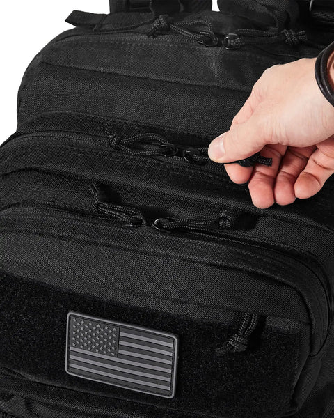 Hand pulling zipper on Rugged 50L Tactical Backpack For Men And Women With Two Point Four Times Stronger Fabric Water Resistant Military Molle Rucksack Bugout Style Gear Pack For Work Outdoors Camping And Travel Heavy Duty