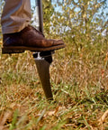 Heavy Duty All Steel Long Handle Garden Shovel for Digging and Landscaping built to last with rugged blade used in a garden