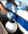 Person using Original 1994 Crinkle Grip Work Gloves With Natural Latex Palm, Blue, Small, securing a boat fender.