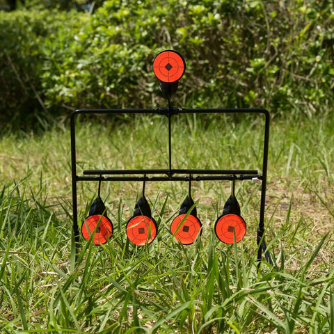 Heavy Duty Steel Resetting Target For Air Pistols And BB Guns, 1.7 Inch Plinking Targets in a green grassy backyard setting