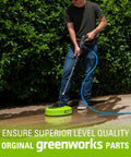 Man using 12 Inch Surface Cleaner Attachment For Pressure Washers With One Quarter Inch Quick Connect on a concrete path