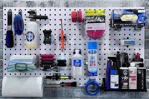 LockHook Steel Pegboard Hook Set 63 Piece Garage Organization Kit For LocBoard with tools and cleaning supplies organized.