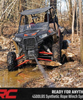 Rough Country 4500 Lb ProSeries Winch For Utv And Atv With Fifty Ft Synthetic Rope 1.4HP Motor 12V waterproof remote control used in muddy terrain.