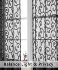 Black Sheer Curtains 90 Inch Long Two Panel Set with jacquard design, hanging on a window, light filtering, rod pocket style.