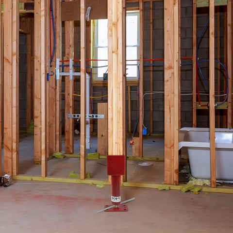 Adjustable Screw Jack Post 14.5-18.5 In For 4x4 Beams in use for house shoring and leveling during basement renovation