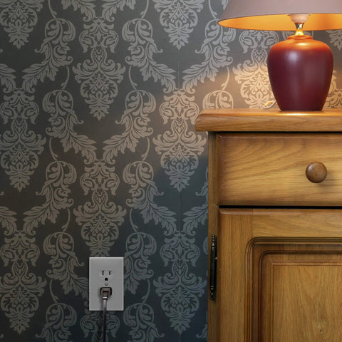 Room with Tamper Resistant Child Safe Duplex Receptacle Outlet 15A 125V, 3 Wire, UL Listed, installed beside wooden furniture