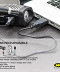 Lumina Micro 850 Front Bike Light USB Rechargeable LED Water Resistant flashlight connected to laptop for charging