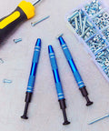 Three Piece Pro Grade Jewelry Ball Grabber Tool Set with four prong precision pickup next to screws and nuts