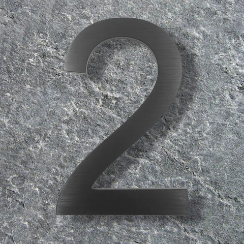 10 Inch Aluminum Floating House Number 2 in Black With Brushed Finish for Slick Curb Appeal Durable Rustproof Street Address Sign Large Contemporary Wall Mount Address Plate shown against stone background