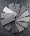 Heavy Duty 1-1/4 Inch 18 Gauge Brad Nails, Galvanized Nail Gun Nails For Pneumatic And Electric Brad Nailer, 5000 Count finish fasteners on a gray surface.