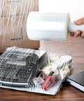 Heavy Duty Rock Solid Stretch Wrap 5 Inch By 1000 Feet Roll With Built In Handle used to secure items like a printer and supplies.
