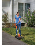 Person using 3-In-1 Electric Lawn Mower Weed Eater And Edger For Small Yards Corded 12-Inch 6.5 Amp Powerdrive Motor