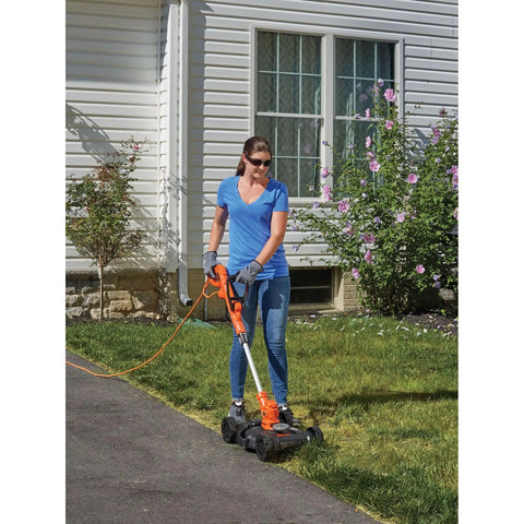Person using 3-In-1 Electric Lawn Mower Weed Eater And Edger For Small Yards Corded 12-Inch 6.5 Amp Powerdrive Motor