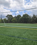 Regulation Size 24 By 8 Soccer Goal With Steel Frame, Heavy Duty Portable Pro Grade Practice Net Included on a field.