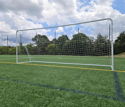 Regulation Size 24 By 8 Soccer Goal With Steel Frame, Heavy Duty Portable Pro Grade Practice Net Included on a field.