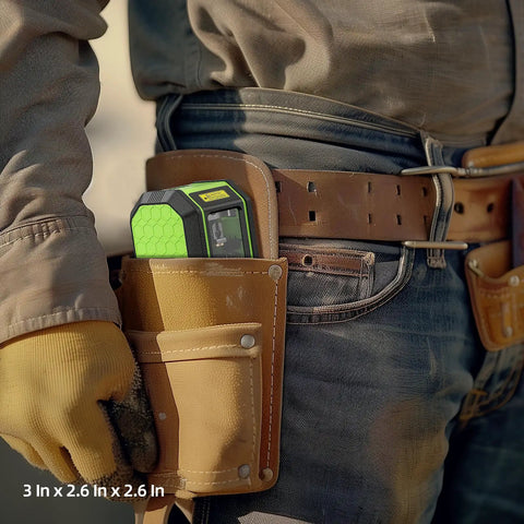Worker carrying a self leveling green cross line laser level with 100 ft range for DIY construction in a tool belt, 3x2.6x2.6 inches.