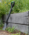Mini Digging Shovel Built Tough With Heavy Duty Carbon Steel Head And Serrated Blade, Ergonomic No Slip H Grip And D Handle next to garden