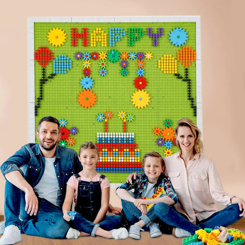 Family enjoying the Game Changing 812 Piece Building Blocks Kit Featuring Self Adhesive Wall Baseplates And Interconnected Marble Run Tracks.