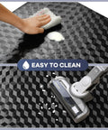 Close-up of a 48 By 30 Inch Chair Mat For Low Carpet Floors, showing textured PVC surface being cleaned with a sponge and vacuum.