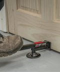 Swivel Type Door And Board Lifter With Hands Free Foot Operated Lift lifting a wooden door, showing black construction tool.