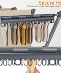 Close-up of Heavy Duty Indoor Clothes Drying Rack With Twelve Solid Horizontal Rods And Tight Grip Sock Clips holding socks with non-slip clips.