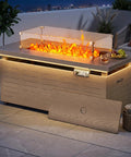 51 Inch Propane Fire Pit Table With 50,000 BTU Smokeless Heat, glass wind guard, wood grain design on patio at night