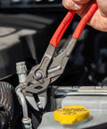Heavy Duty 10 Inch Pliers Wrench With Adjustable Smooth Jaws being used on a car's engine, showcasing grip on a metallic fitting.