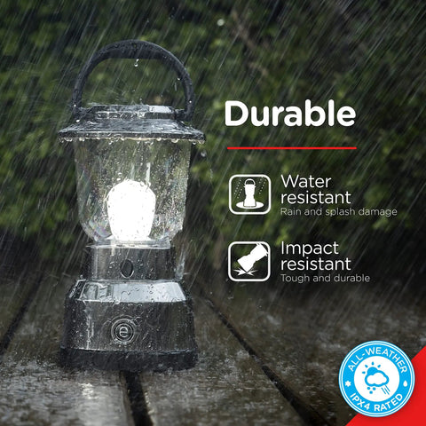 Battery Powered Camping Lantern With 550 Lumens, 360 Degree Light, 200 Hour Run Time On D Batteries in rain showing durability icons