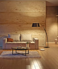 Living room with cozy lighting from 8W LED A19 Clear Filament Style Light Bulbs 3000K Soft White, Medium Base, warm urban interior.