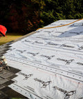 Contractor applying Top Shelf Synthetic Roof Underlayment Roll Covers 10 Squares Heavy Duty Waterproof Barrier on roof.