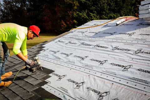 Contractor applying Top Shelf Synthetic Roof Underlayment Roll Covers 10 Squares Heavy Duty Waterproof Barrier on roof.