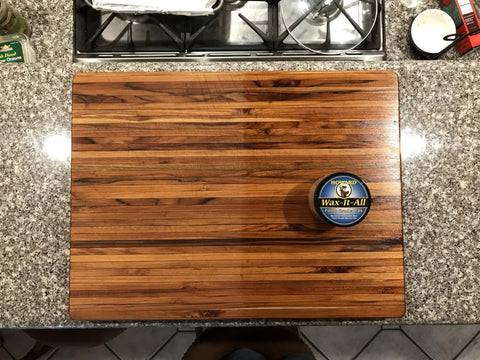Real Deal Food Grade Beeswax Wood Polish And Cutting Board Wax, Zero Hustle Multi Surface Protectant, Nine Oz Jar on wooden cutting board.