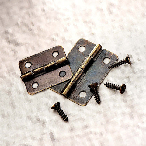 Close-up of Two Size Bronze Mini Hinge Set With 60 Small Hinges And 300 7 Mm Screws In Clear Storage Box For Dollhouse Doors Cabinets Crafts Wooden Jewelry Boxes And Outdoor Decor Totally DIY Ready